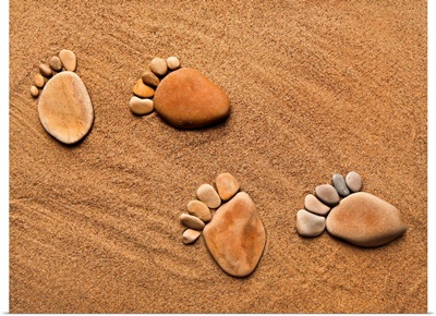 Footsteps made of pebbles on the sand