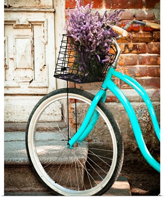 Vintage Bicycle With Basket With Lavender Flowers Near The Wooden Door
