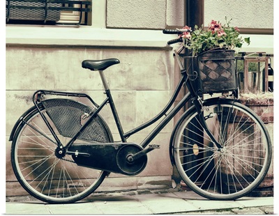Vintage Stylized Photo Of Old Bicycle Carrying Flowers