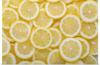 Yellow Sliced Lemons Places On A Table Overlapping Each Other