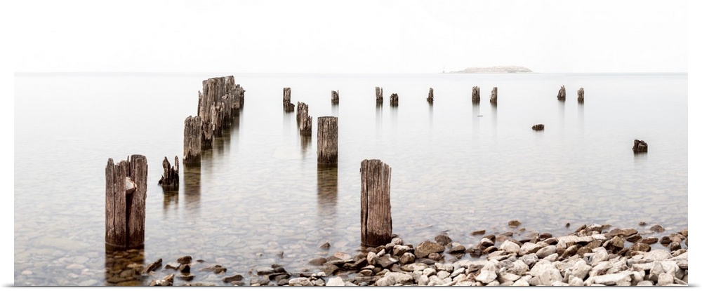 Abandoned dock pilings along Okanagan Lake, Canada creating a minimalist image.
