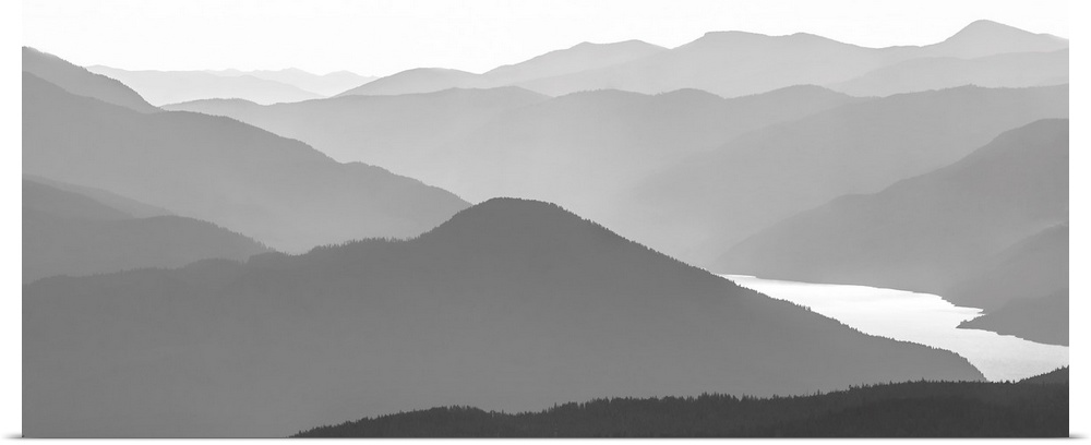 Black and white image of many layers of mountain range in the Monashee Mountains, Canada.