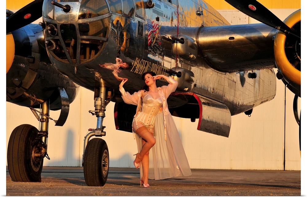 Sexy 1940's pin-up girl in lingerie posing with a B-25 bomber.