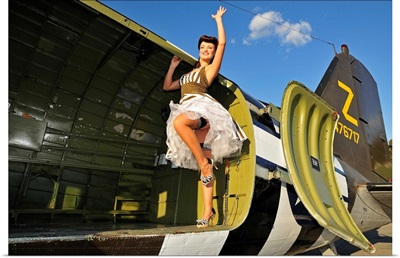 1940's style pin-up girl standing inside of a C-47 Skytrain aircraft