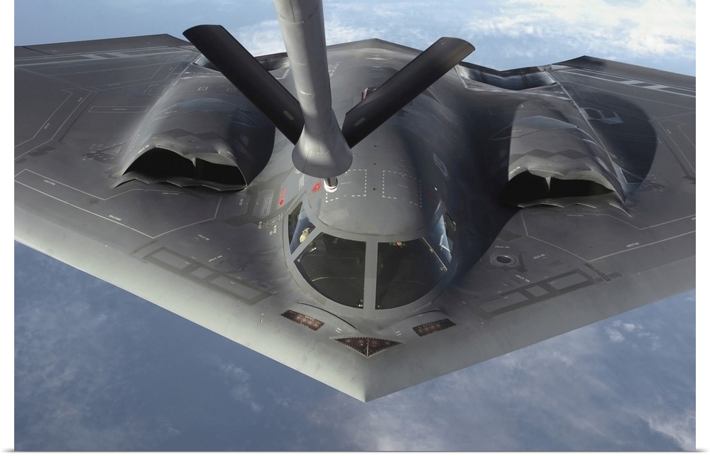 Over the Pacific Ocean - A B-2 Spirit bomber prepares to refuel from a KC-135 Stratotanker during a deployment to Andersen...