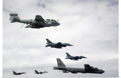 A B-52 Stratofortress leads a formation of aircraft over Guam