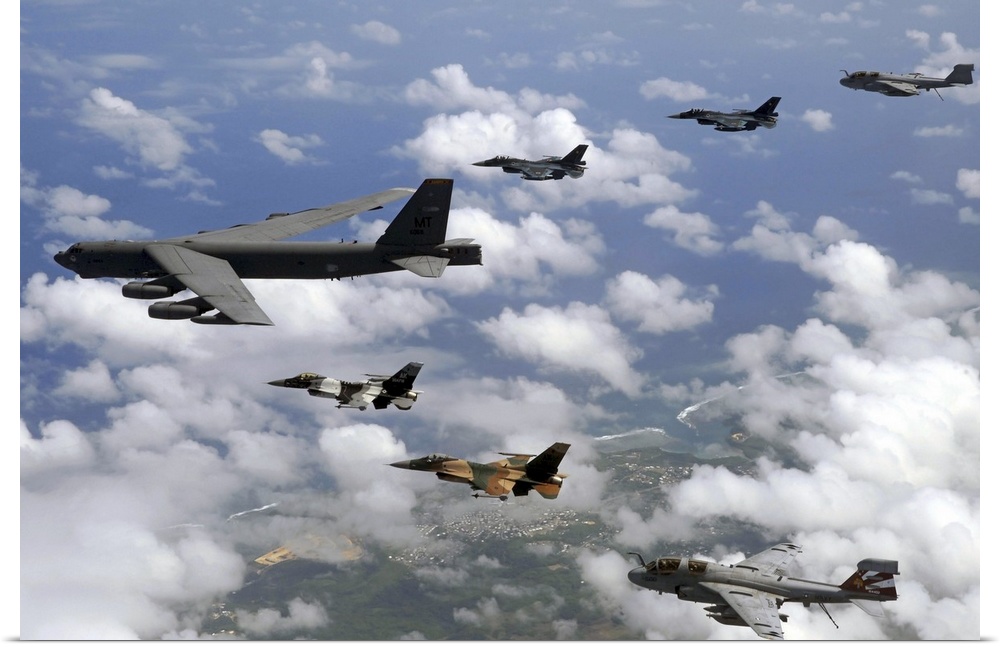 A B-52 Stratofortress leads a formation of aircraft over Guam.