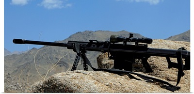 A Barrett .50-caliber M107 Sniper Rifle sits atop an observation point in Afghanistan