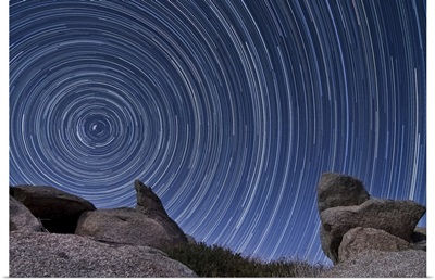 A boulder outcropping and star trails in Anza Borrego Desert State Park, California