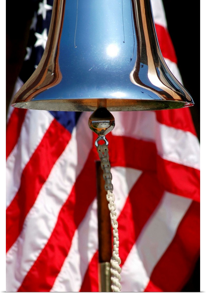 A ceremonial ships bell displayed during a dedication ceremony.