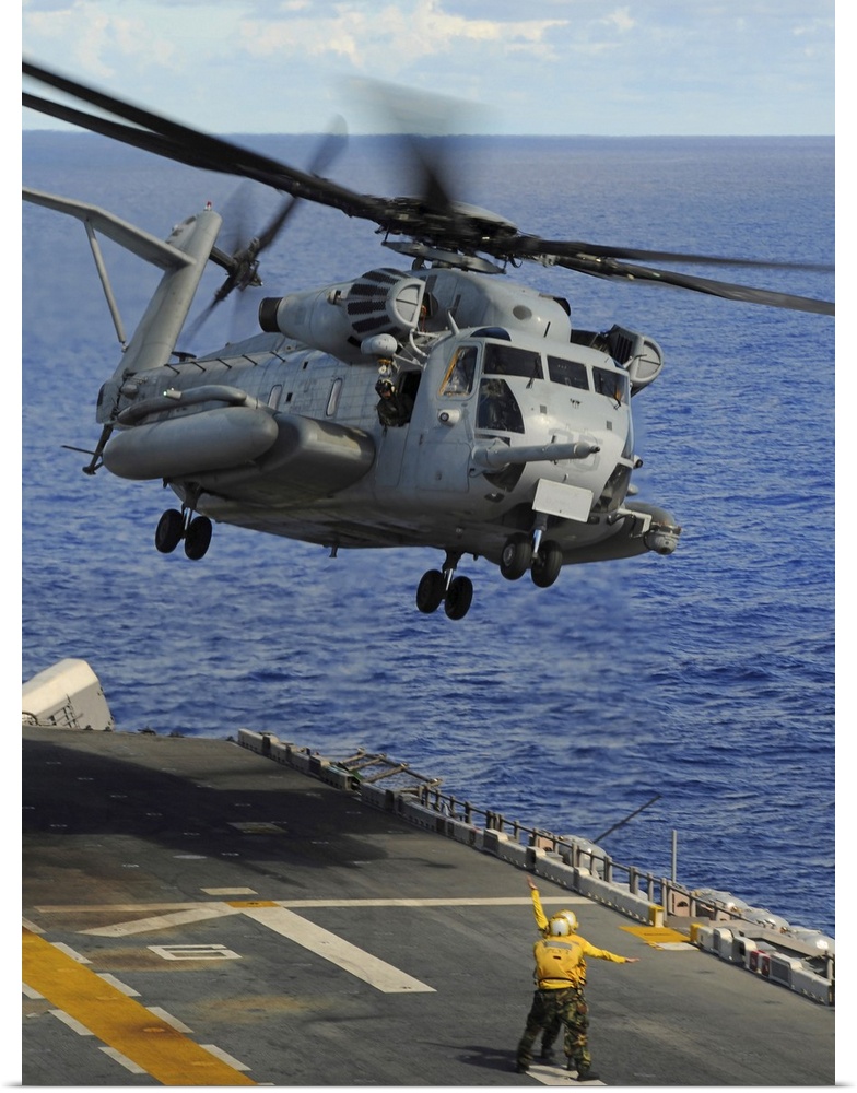 Philippine Sea, September 14, 2010 - A CH-53E Sea Stallion helicopter takes off from the forward-deployed amphibious assau...