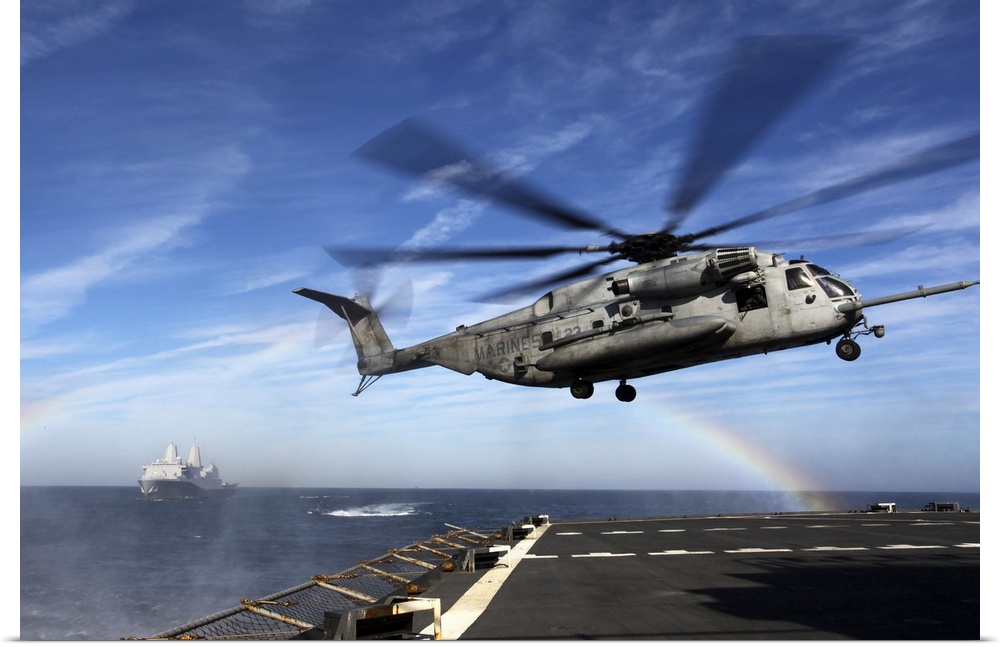 December 7, 2011 - A CH-53E Super Stallion prepares to land on the USNS Arctic during a simulated Expanded, Visit, Board, ...