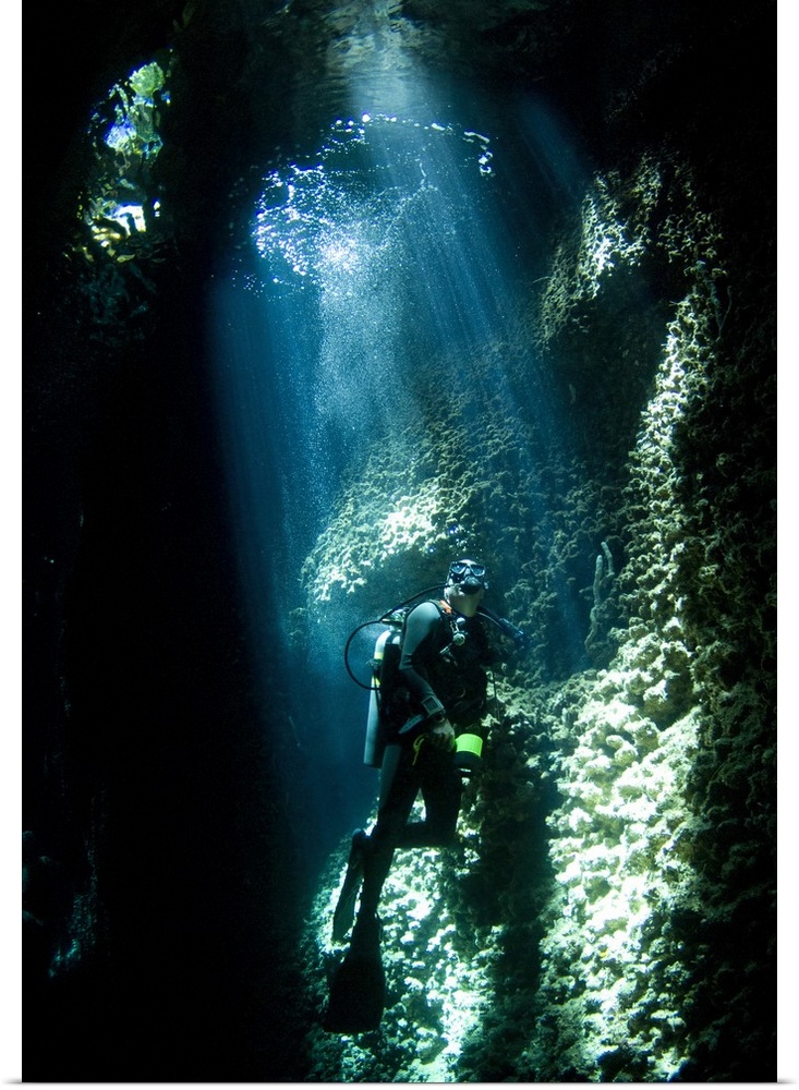 A diver explores the Lerus Cut underwater cavern, Solomons.