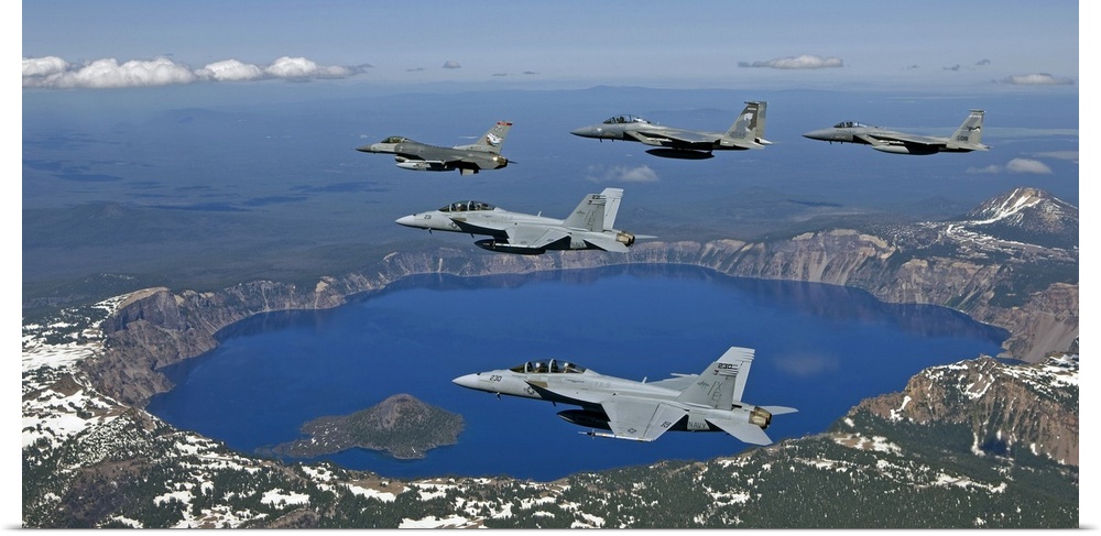A five ship formation of two F-15 Eagles, two F-18 Super Hornets and an F-16 Fighting Falcon fly over Crater Lake, Oregon,...
