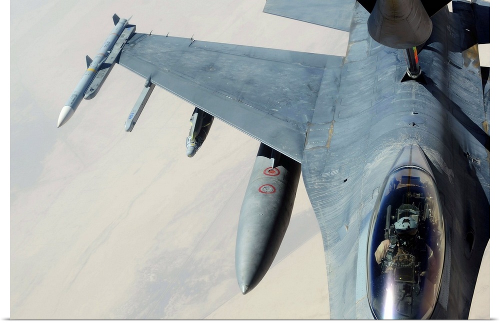 A KC135 Stratotanker refueling an F16CJ Fighting Falcon over Iraq