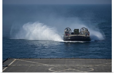 A Landing Craft Air Cushion Makes Its Approach To The Well Deck Of USS Comstock