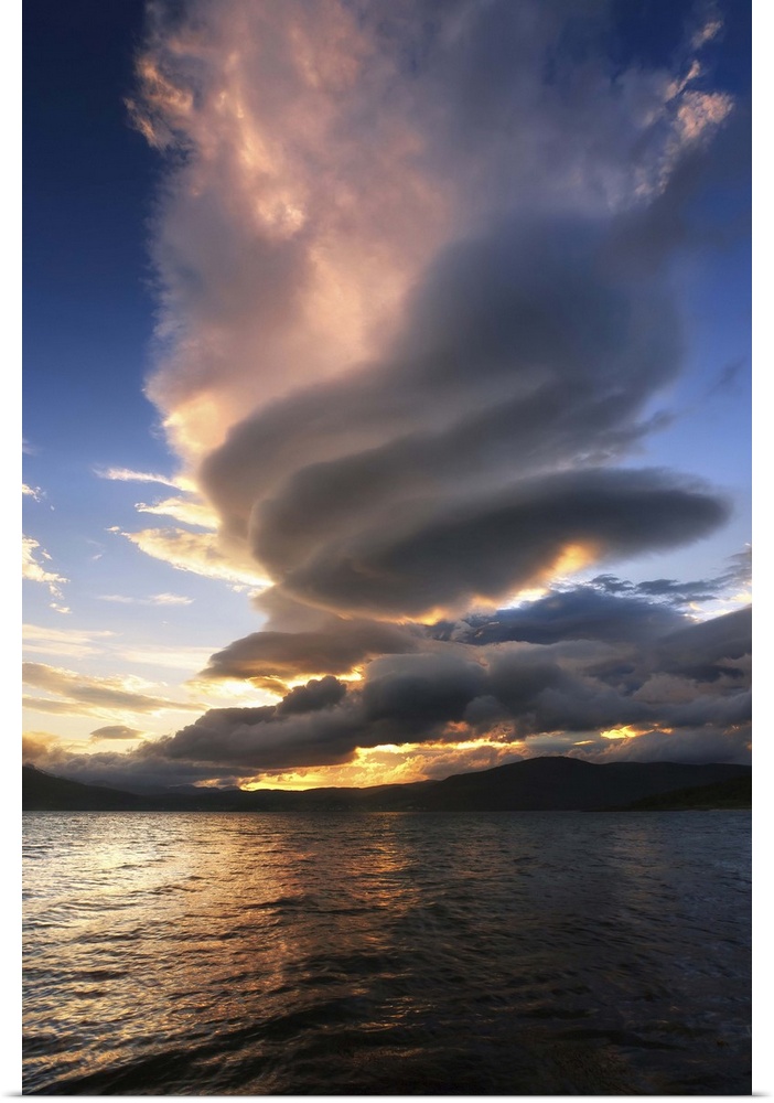 A massive stacked lenticular cloud over Tjedsundet in Troms County, Norway.