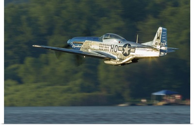 A P-51 Mustang flies along the Mississippi at Dubuque, Iowa