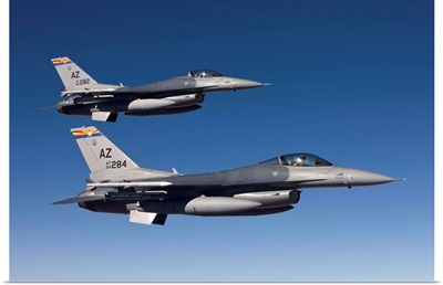 A pair of F-16s fly in formation over Arizona
