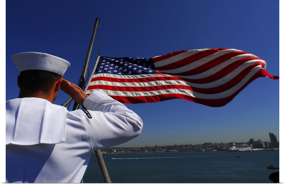 Pacific Ocean, August 28, 2007 - Aviation Boatswain's Mate (Fuel) Airman Apprentice salutes the national ensign as it is l...