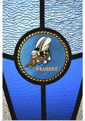 A single Seabee logo built into a stainedglass window