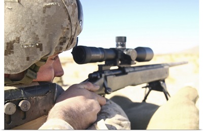 A soldier aims in with his M40A3 Scout Sniper Rifle