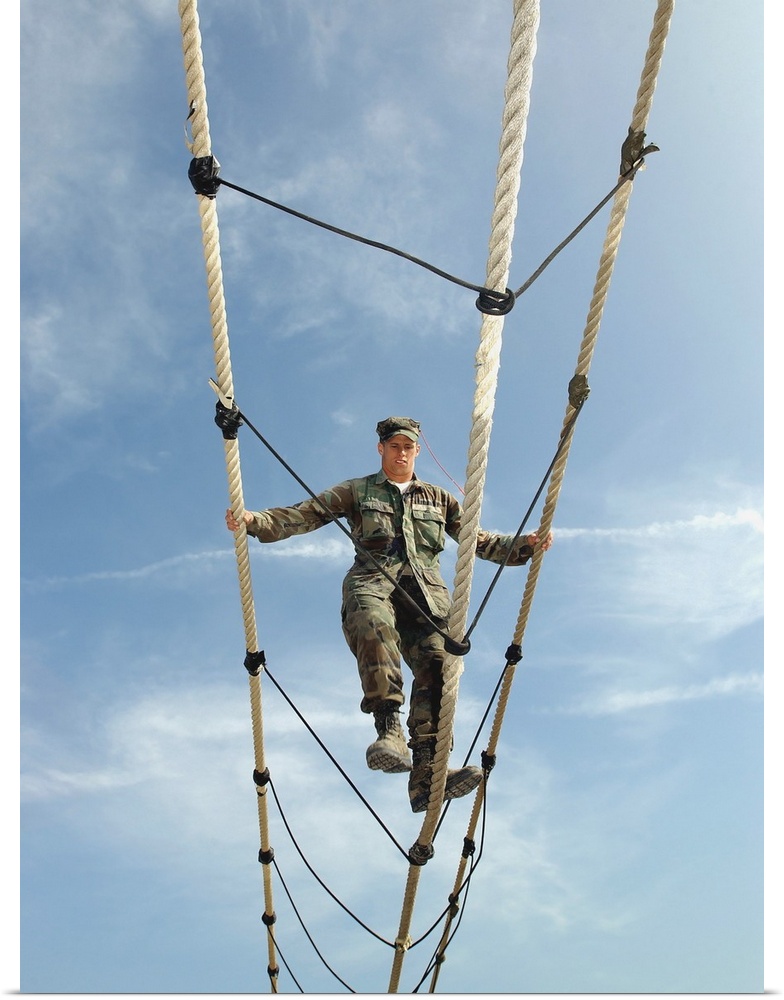 A soldier navigates an obstacle on  the training course.