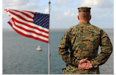 A soldier stands at attention on USS Bonhomme Richard