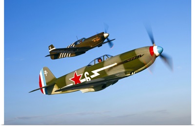 A Soviet Yakovlev Yak 3 and a P 51A Mustang in flight