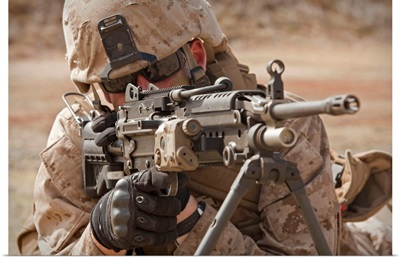 A squad automatic weapon gunner provides security