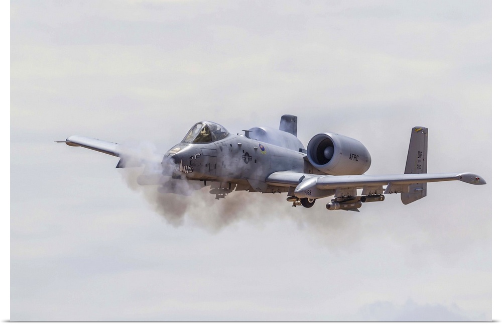 A U.S. Air Force A-10 Thunderbolt II fires its 30mm cannon on a low level strafe run at the Barry M Goldwater range south ...
