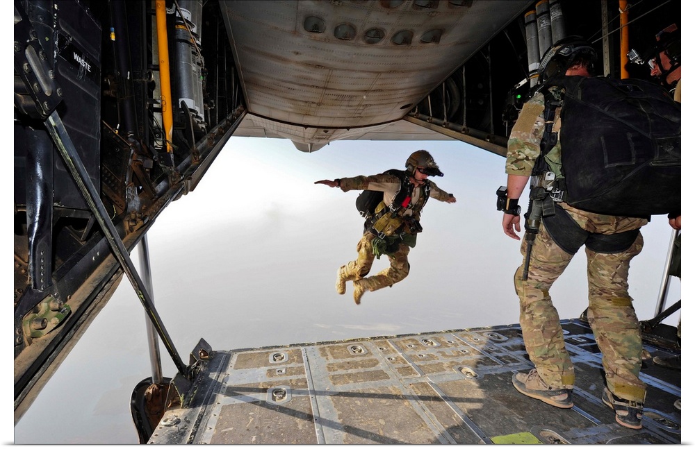 July 30, 2012 - A U.S. Air Force pararescueman jumps out of the back of an HC-130P Combat King aircraft over the Grand Bar...