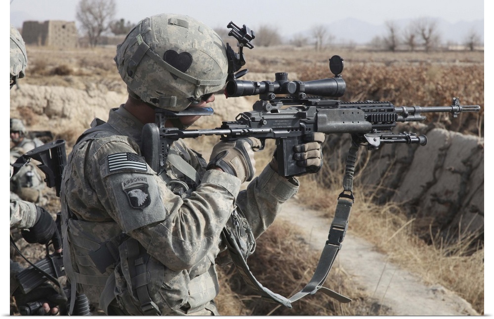 January 12, 2011 - A U.S. Army soldier looks through the scope of his M-14 sniper rifle near Howz-e Madad, Kandahar provin...