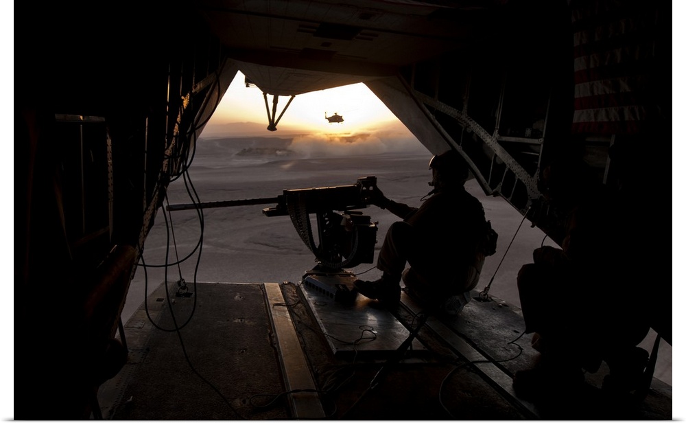 October 28, 2013 - A U.S. Marine provides aerial security from a CH-53E Super Stallion over Helmand Province, Afghanistan.