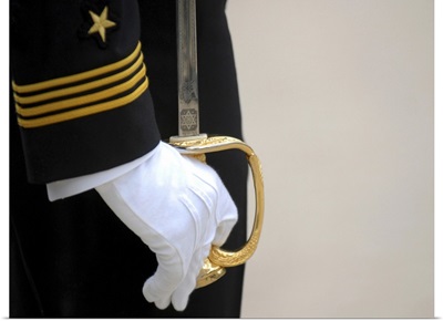A U.S. Naval Academy midshipman stands at attention