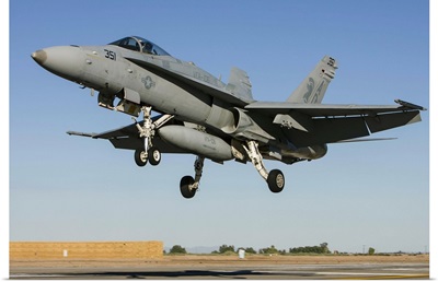 A U.S. Navy F/A-18C Hornet prepares for landing