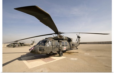 A UH60 Blackhawk Medivac helicopter sits on the flight deck at Camp Warhorse