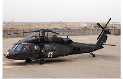 A UH60 Blackhawk Medivac helicopter sits on the flight deck at Camp Warhorse