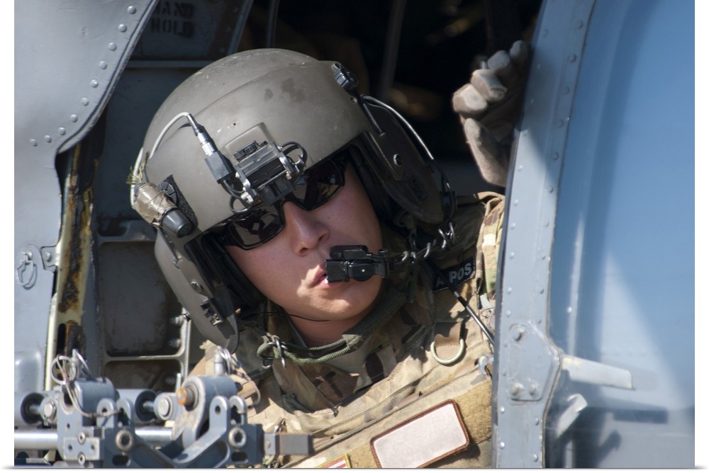 San Diego, November 7, 2012 - A U.S. Air Force Airman peers out the side of a HH-60 Pave Hawk helicopter during a simulate...