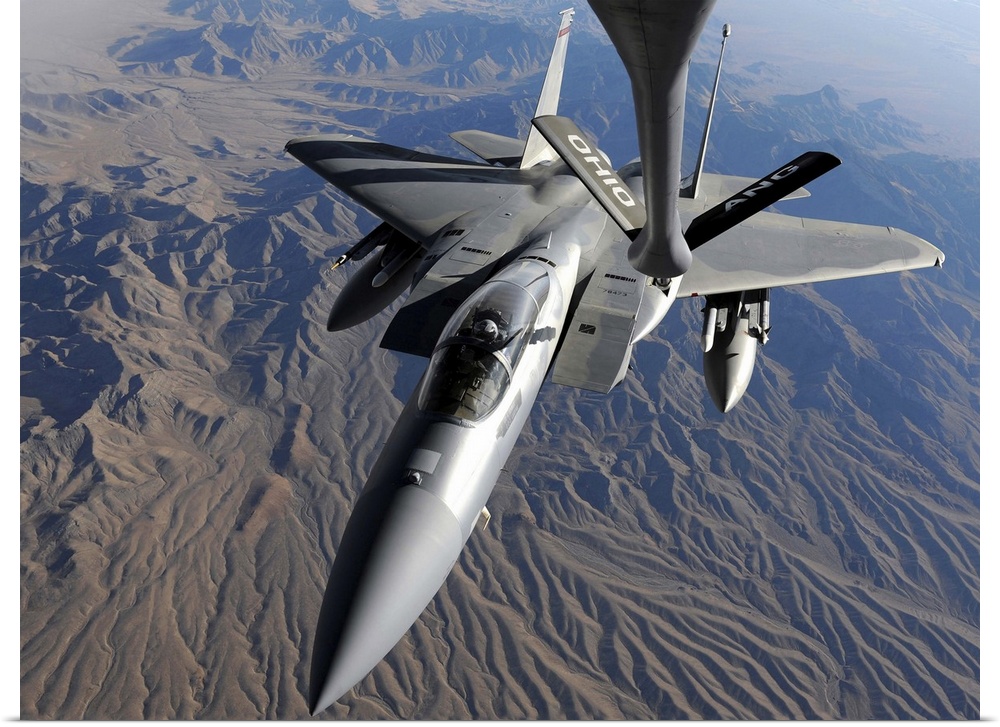 A US Air Force F15 Eagle flies toward the boom of a KC135 Stratotanker