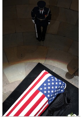 A US Air Force Honor Guardsman stands watch over the casket