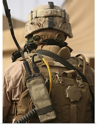 A vehicle commander with his radio equipment attached to his vest