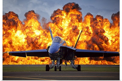 A Wall Of Fire Erupts Behind A US Navy F/A-18 Hornet Aircraft