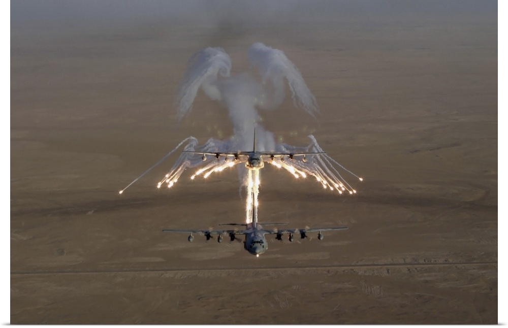 Aerial shot over Iraq of a KC-130 Stratotanker firing flares.