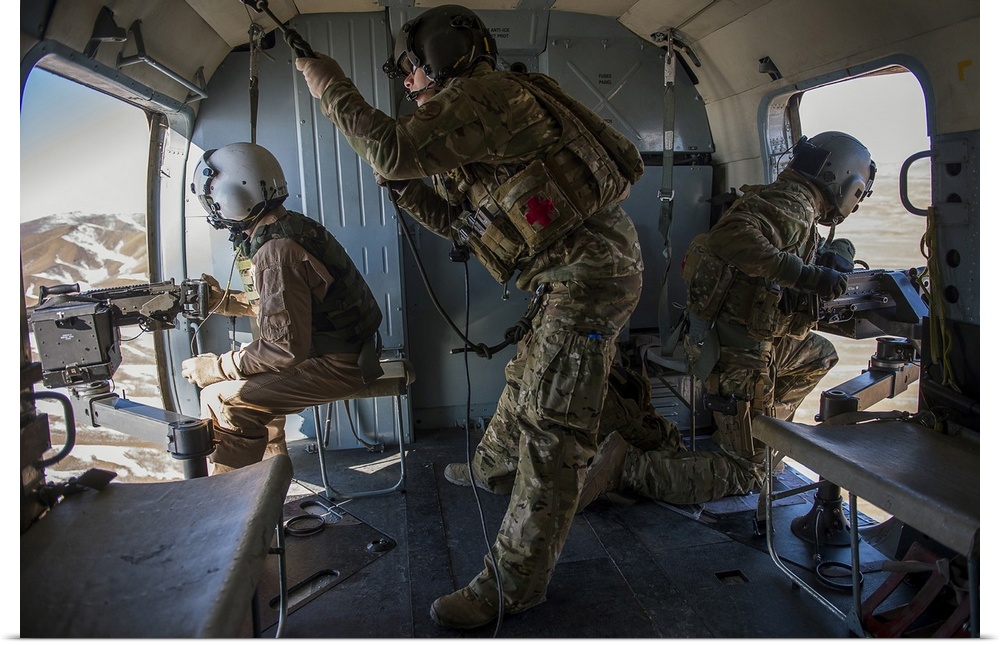 Afghan Air Force members inside of a Mi-17 helicopter over Kabul, Afghanistan.