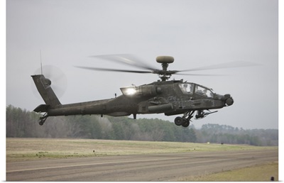 An AH-64 Apache helicopter in midair, Conroe, Texas