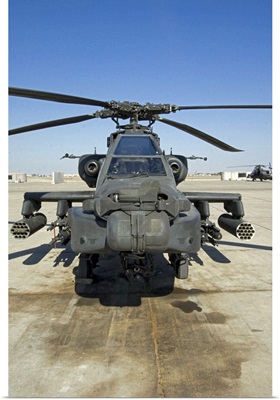 An AH64D Apache Longbow Block III attack helicopter sits on the flight line