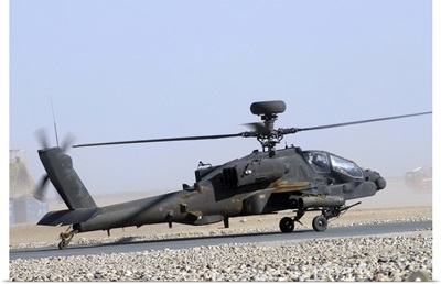 An Apache helicopter prepares for takeoff at Camp Bastion, Afghanistan