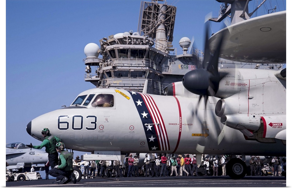 Arabian Gulf, August 23, 2014 - An E-2C Hawkeye prepares to launch from the flight deck of the aircraft carrier USS George...