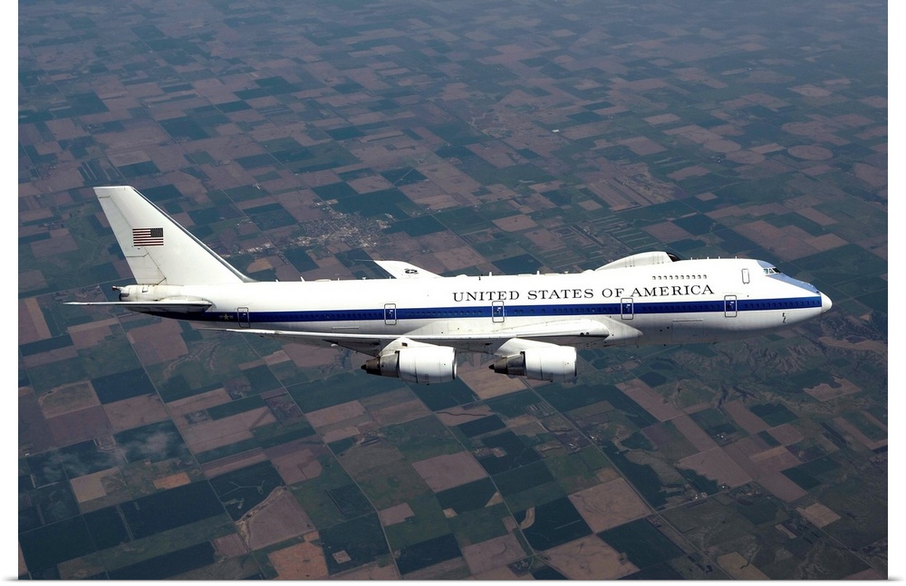 An E-4B National Airborne Operations Center (NAOC) aircraft flies high over the Midwest on a training mission out of Offut...